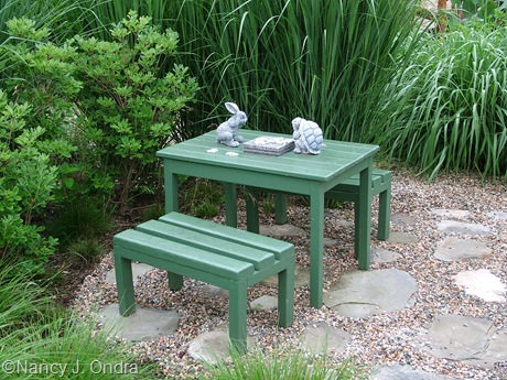 Mini picnic table in courtyard early July 05
