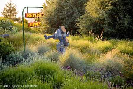 Art, sculpture of children playing leapfrog in California meadow garden Retired Lawn - Free At Last