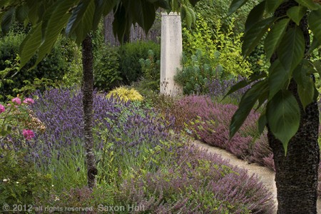 rammed earth column at garden entry